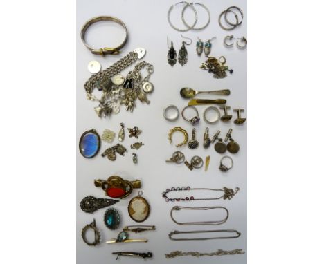 Silver and other jewellery, comprising; two charm bracelets, a bangle, seven brooches, four rings, a marcasite set dress clip