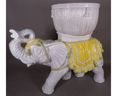 A 20th century ceramic jardiniere formed as an elephant, 75cm wide x 63cm high. 