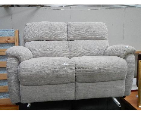 A good 2 seater ivory coloured sofa.