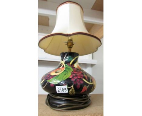 A Moorcroft table lamp with shade.