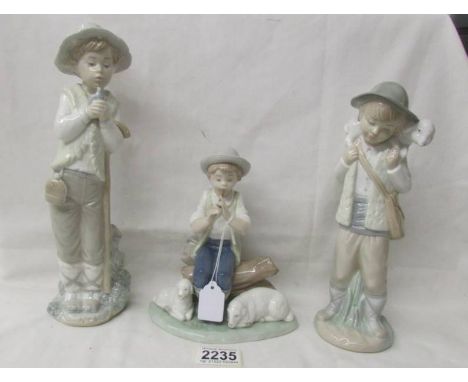 Three NAO figurines - 2 boys with sheep and a boy with bird.