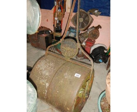 An old metal garden roller.