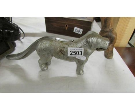 A metal dog nut cracker.