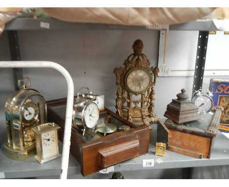 A Shelf of old clocks, some a/f.