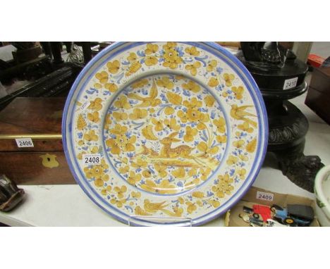A large ceramic charger. ****Condition report**** Diameter 43cm, no damage, dished 6.5cm.