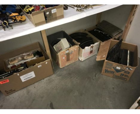 A boxed Scalextric, hand controllers etc. Also power supplies &amp; large quantity of vintage track (5 boxes)