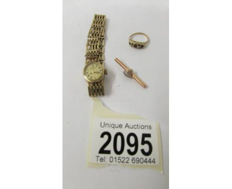 A 9ct gold ladies Rotary wrist watch and 2 other gold items, 21.5 grams in total.