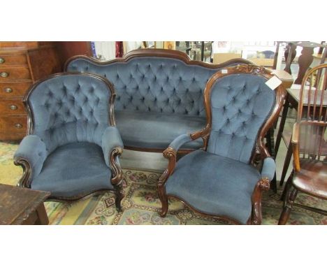 A mahogany framed 19th century three piece suite comprising sofa, ladies chair and gentleman's chair upholstered in blue.