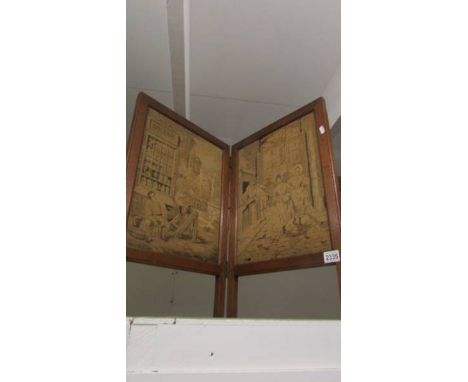 A oak framed double firescreen inset tapestries.