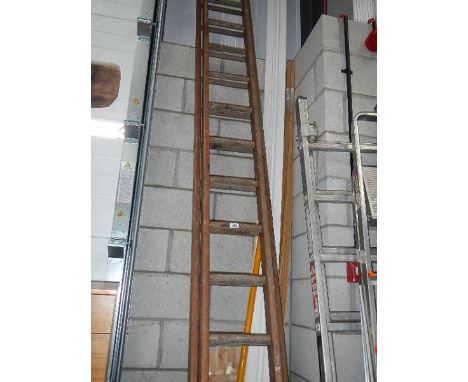 A 12 double rung wood ladder in good condition.