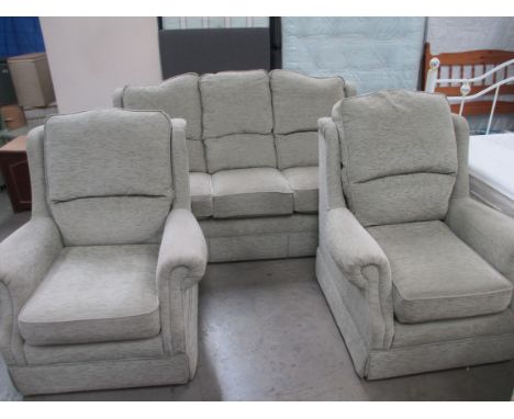 A 3 seater sofa and 2 arm chairs