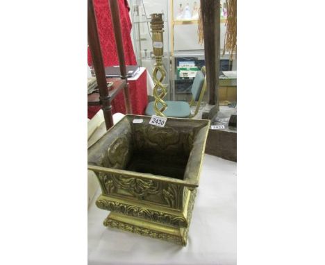 A brass planter (missing bottom) and a brass barley twist table lamp base.