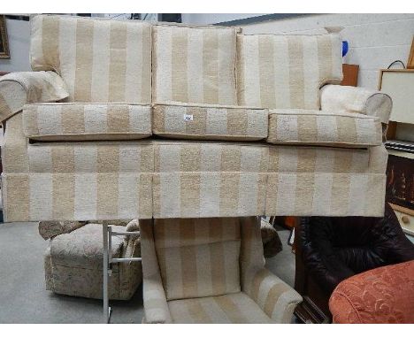 A three seater sofa and chair.