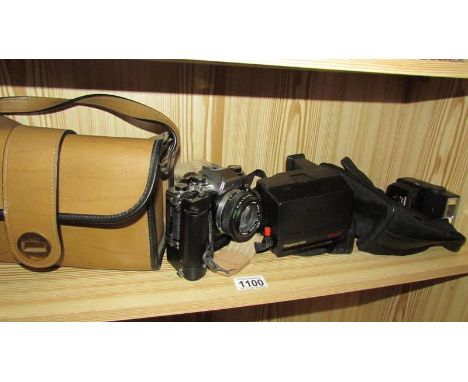 An Olympus camera. Polaroid etc.,