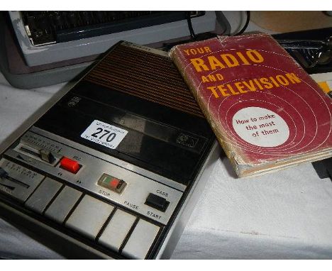 A Microfon tape recorder and a book on radio and television.