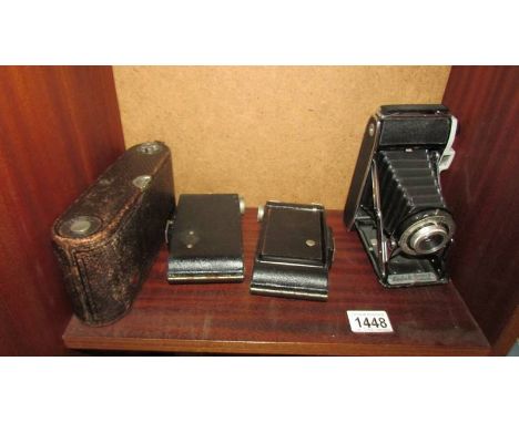 A Kodak Number 1a pocket Kodak special in brown leather case, 2 Kodak folding 620 Brownie camera's and a Kodak Junior II fold
