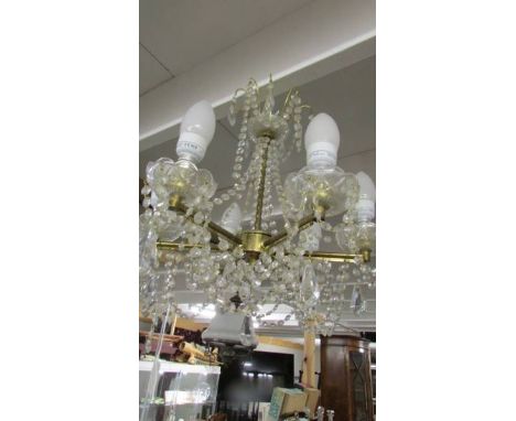 A good brass and glass 6 lamp chandelier.