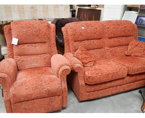 A 2 seater sofa and an electric arm chair.