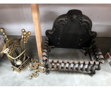 A cast iron fire grate &amp; brass fire tools