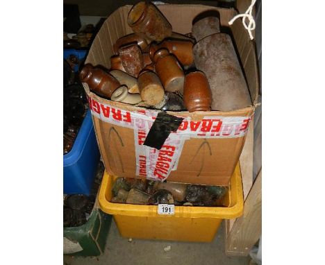 Two boxes of assorted glass and ceramic bottles.