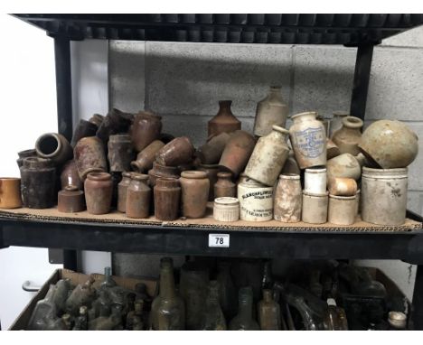 A shelf of brown/white stoneware