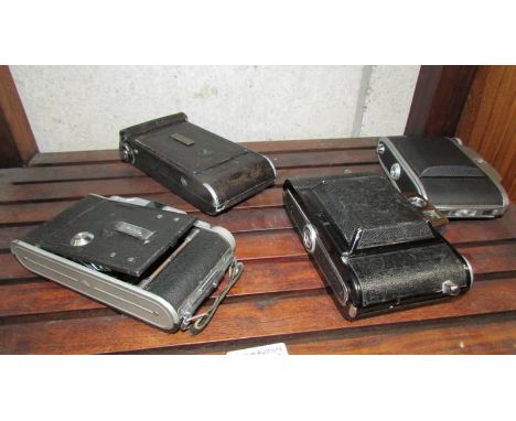 An ILA Presden Icarette 11500, Coronet Rapide, Agifold and one other folding camera.