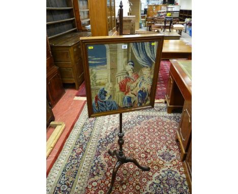 A GEORGIAN MAHOGANY POLESCREEN with classically scened rectangular framed panel on a finial capped turned pole and tripod car