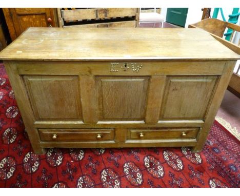 AN 18TH CENTURY OAK MULE CHEST, twin plank chamfered edge top over a three panel front with two raised chamfered lower drawer