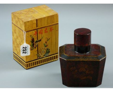 TWO ORIENTAL TEA CADDIES, a gilt decorated lacquerwork canister shaped caddy and a lidded bamboo caddy with applied flower an