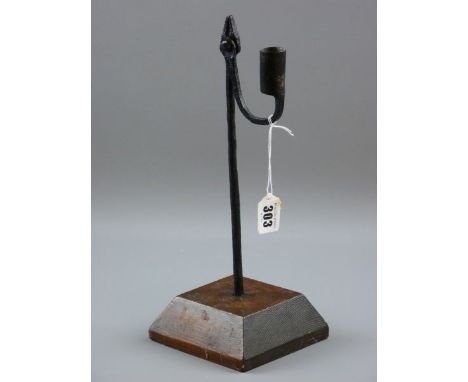 AN 18TH CENTURY RUSH LIGHT HOLDER, 32 cms tall iron rush nip with sconce counterweight in a slightly later chamfered square b
