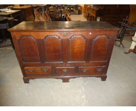A Large early 19th century oak Lancashire Mule Chest, Hinged Lid, four panels over three drawers on bracket freet