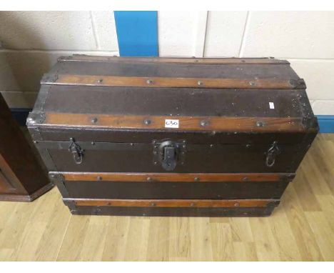 An Early 20th Century Canvas travel trunk with wooden laths