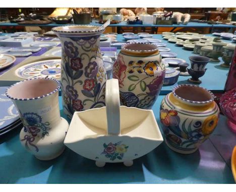 A small collection of early to mid twentieth century Poole Pottery vases, one with harebell decoration 21.5cm H and smaller