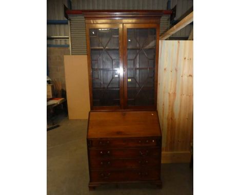 A Victorian mahogany elevated bureau bookcase with glazed doors, and with four drawers on the bracket feet 236cm H