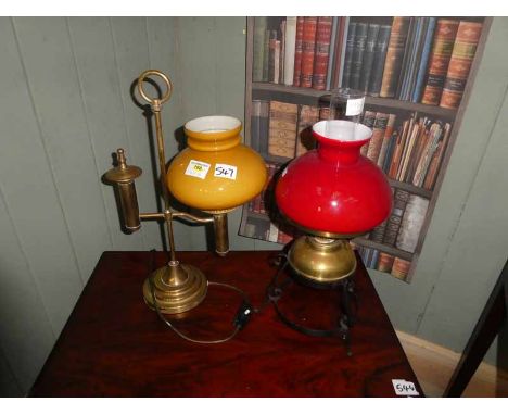 One parafin lamp with wrought iron stand and one gas style table lamp converted for electricity (2)