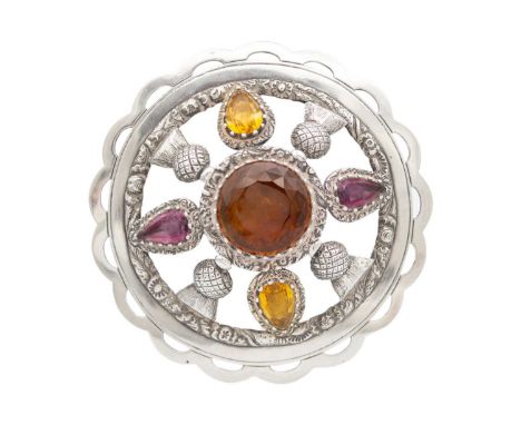 A 19th-century Scottish large silver amethyst and citrine set kilt pin or plaid brooch. Of circular domed form with a large 2