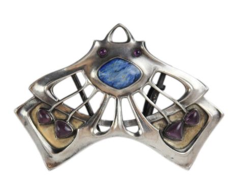 A Secessionist 800 silver and gilt, enamel and purple paste set buckle. Of sinuous openwork form with cabochon flower heads a