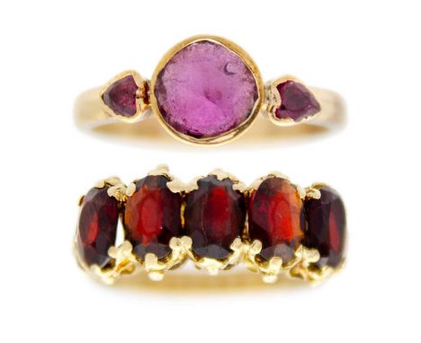 Two 9ct gold gem set rings. One is set with three pink sapphire, size N, unmarked but tested as 9ct; the other ring is set wi
