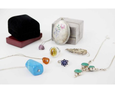 A small selection of costume jewellery. To include a large silver plated and enamel locket pendant, decorated to the front wi