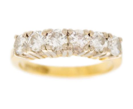 A modern 18ct yellow and white gold diamond set six stone half hoop ring. The round brilliant cut stones of 1.20ct total esti