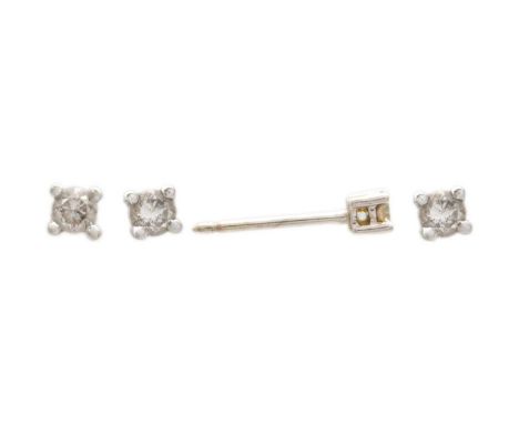 Four white gold diamond solitaire set stud earrings. One pair in 18ct gold with 0.08ct estimated round brilliant cut diamond,