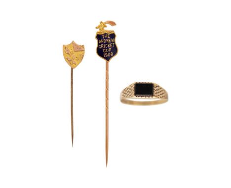 A Edwardian 9ct and blue enamel stick pin, a 9ct head pin and a 9ct and onyx ring. The 9ct and enamel pin by Mappin &amp; Web