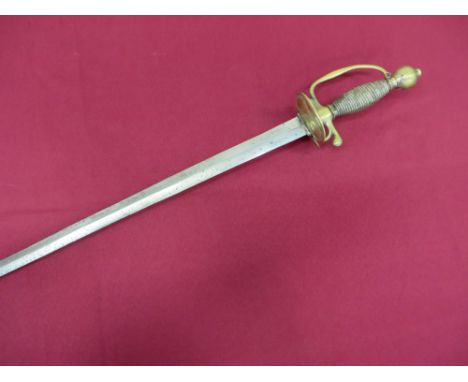 27 3/4 inch double edged blade.  Brass double shell guard.  Brass Pas d’Ane, quillon and D shape knuckle bow.  Brass urn pomm