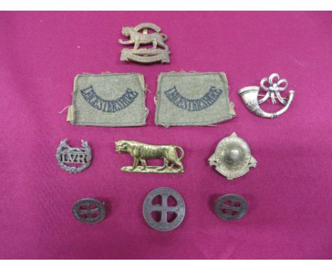 consisting cast brass tiger (cast lugs) ... Gilt Leicestershire Officer’s cap badge (blades) ... Pair embroidery Leicestershi