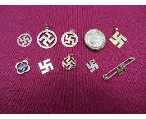 consisting 7 small gold 9C marked various swastikas ... Gilt swastika tie pin ... Gilt swastika locket ... Gilt and enamel pe