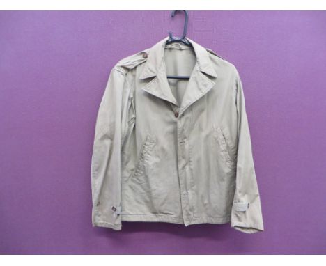 light khaki green, single breasted open collar shirt jacket.  The front fastened by a zip and buttons.  Angled waist open poc