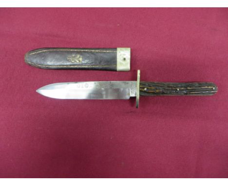 5 1/2 inch single edged blade with sharpened back edge point.  The blade flat etched “Hunters Companion.  The Real 010 Knife”