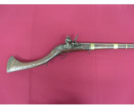 50 1/2 inch smoothbore barrel with large breech.  Lock plate with engraved animal.  Ring neck flintlock.  Steel frizzen and r