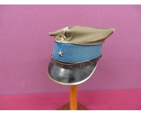square khaki crown with silver cord cross and edging.  Lower light blue band.  Black composite peak with plated brass edging.