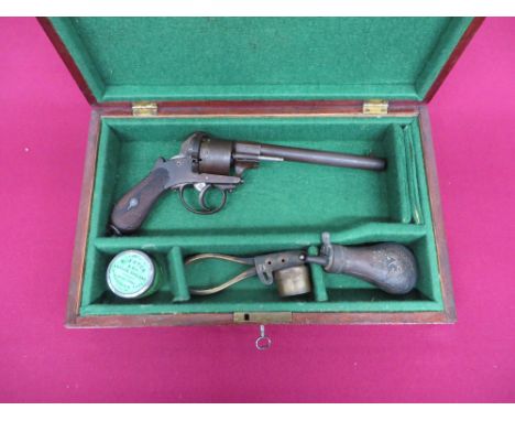 6 1/4 inch barrel with rear side fixed cleaning rod.  Six shot plain pinfire cylinder.  Plain frame.  Double action hammer.  